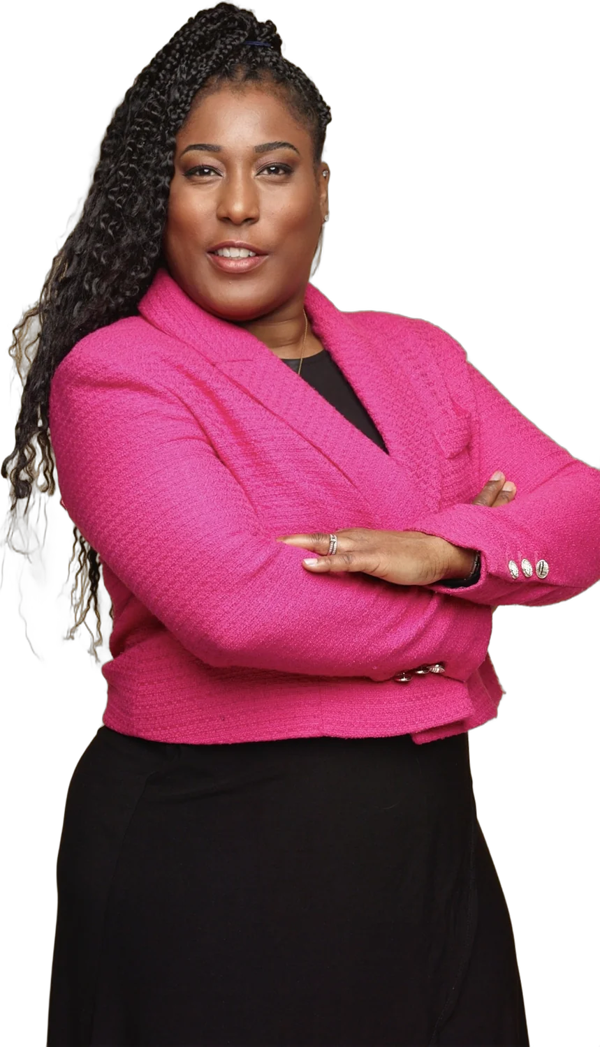 Zoe Bennett in a pink blazer, arms folded
